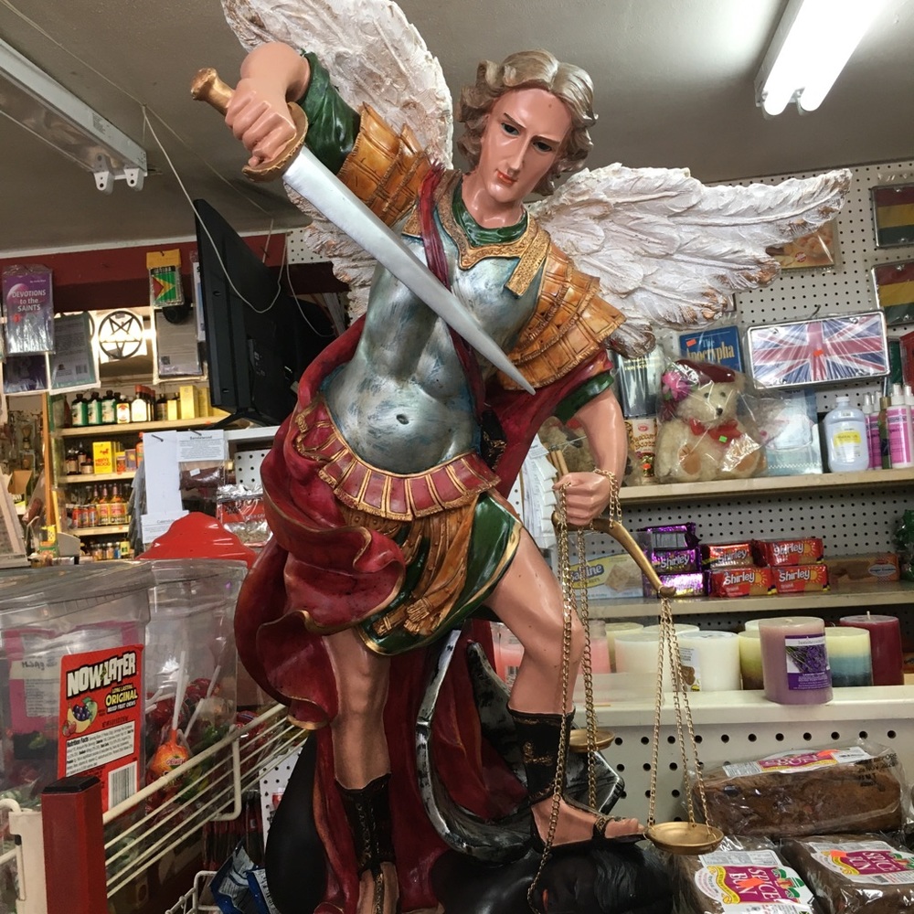 Angel saying demons statue